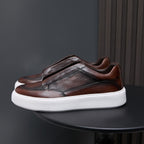 Dark brown genuine leather low-top sneakers with stitched side panel and white rubber sole