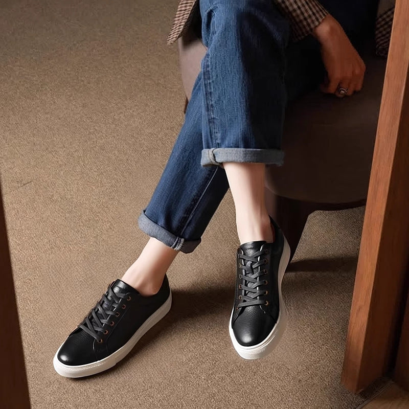 Men's black leather lace-up sneakers with low-profile white sole