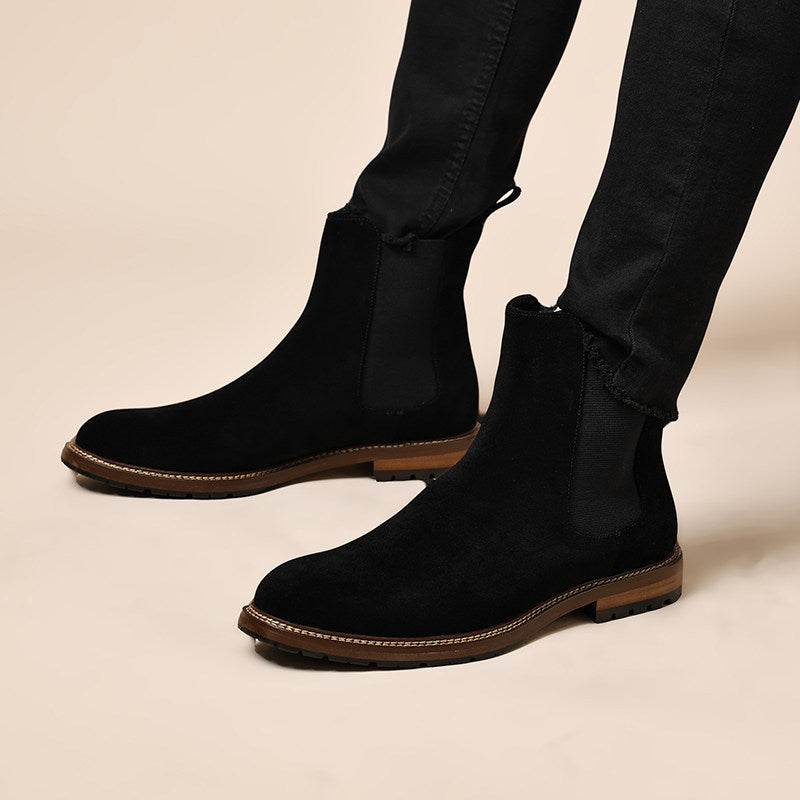 Men's black leather Chelsea dress boots with side elastic panels and pull-on heel tab