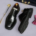 Men's chunky lug-sole wingtip brogue oxford shoes, black, front and side views.