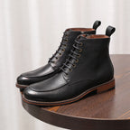 Black and brown leather lace-up ankle boots with side zipper and cap-toe stitching