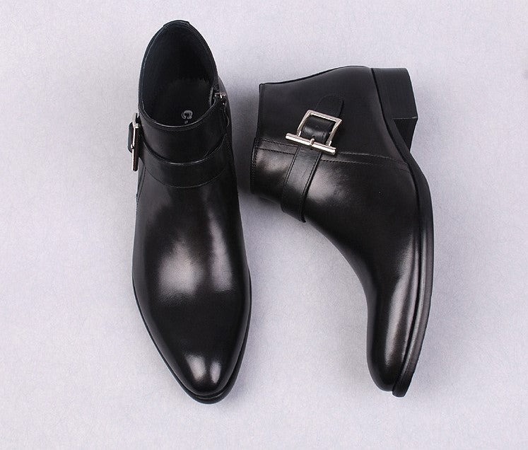Men's black leather dress boots showing side zipper and buckle strap, thick sole.