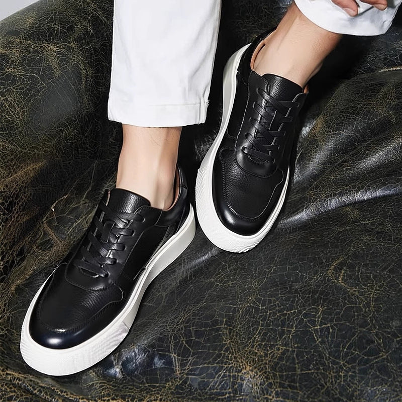 Men's black leather sneakers with lace-up design and thick white rubber sole