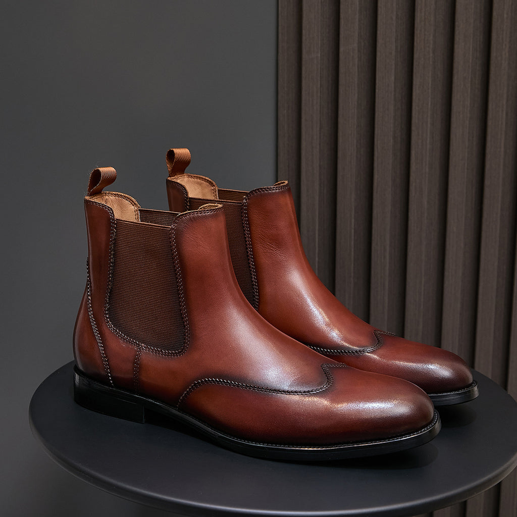 Men's pointed-toe chelsea dress boots in dark brown with elastic side panels and pull tabs
