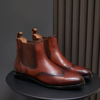 Men's pointed-toe chelsea dress boots in dark brown with elastic side panels and pull tabs
