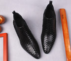 Black leather dress boots with woven pattern and pull-tab collar, side angle pair