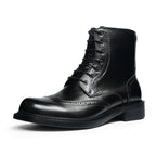 Black leather lace-up dress boots with wingtip detailing and thick sole