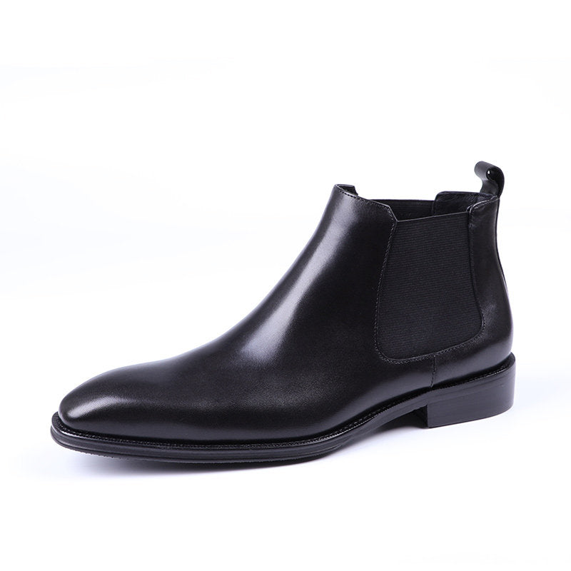 Black leather Chelsea boots with elastic side gore and rounded toe, slip-on style