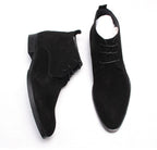 Black suede lace-up dress boots, side view with ankle panel and lace closure