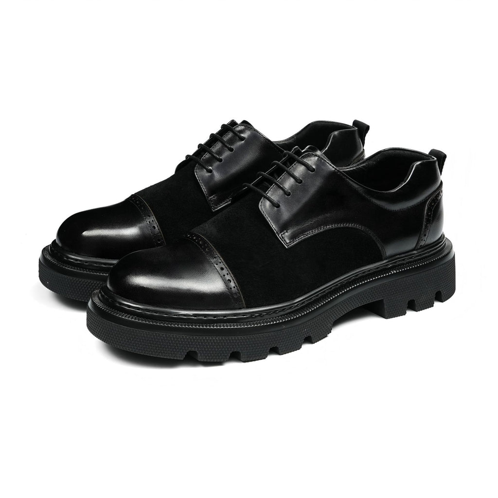Black men’s wingtip brogue oxfords with chunky lug sole and lace-up design