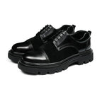 Black men’s wingtip brogue oxfords with chunky lug sole and lace-up design