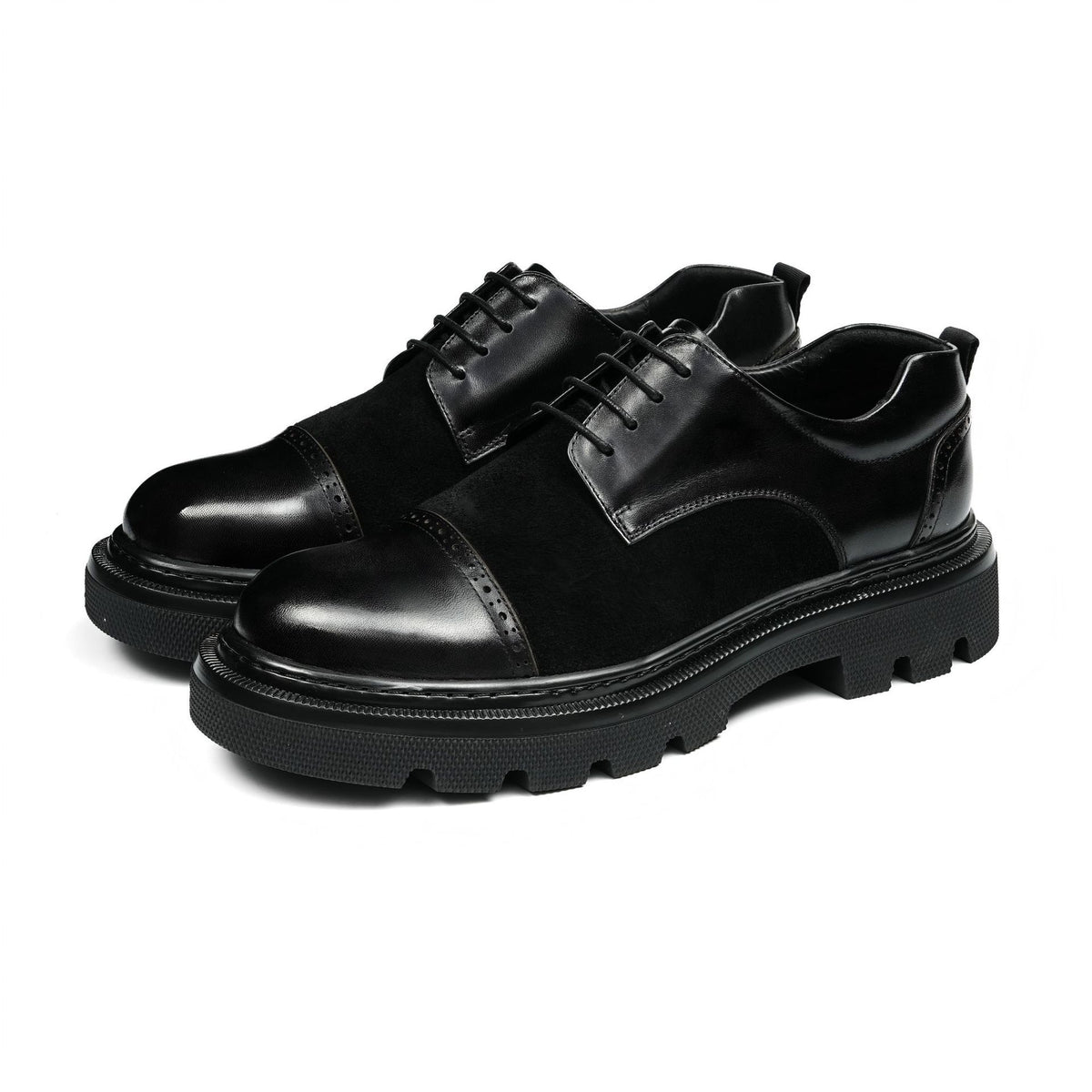 Black men’s wingtip brogue oxfords with chunky lug sole and lace-up design