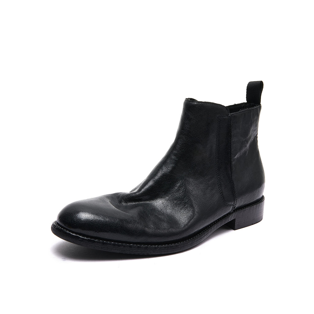 Black leather pointed-toe ankle boots with side zipper and pull tab