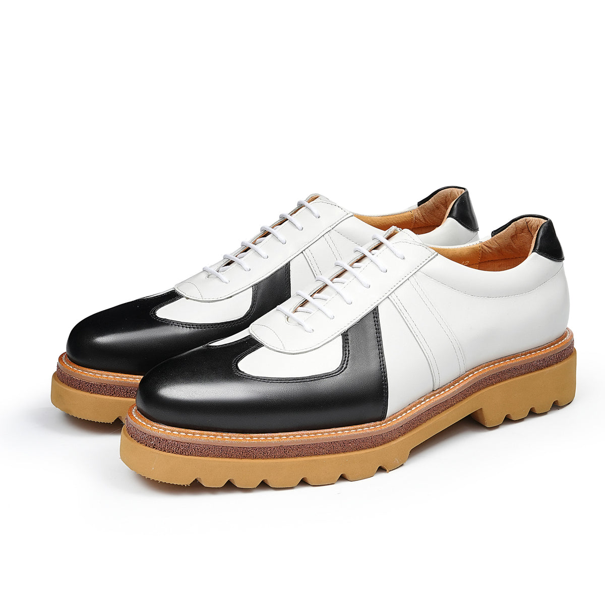 Men's black and white leather suede lace-up sneakers with chunky tan lug sole
