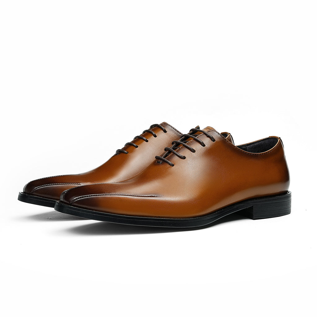 Men's brown wingtip brogue oxford with chunky lug sole and lace-up closure