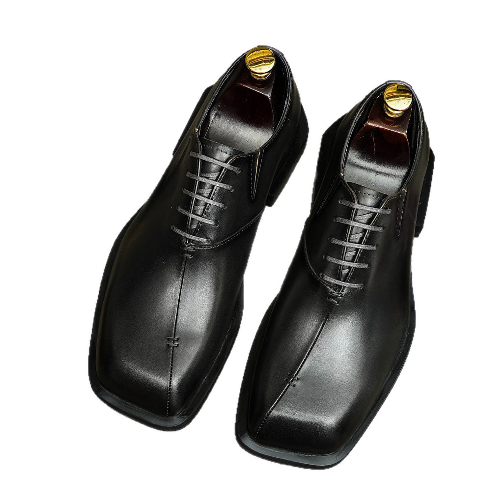 Men's chunky lug-sole wingtip brogue oxfords, black leather look, front pair view.