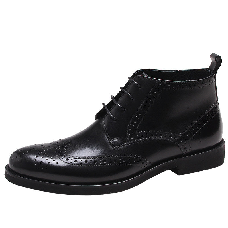 Black wingtip lace-up dress boots with perforated toe and ankle collar
