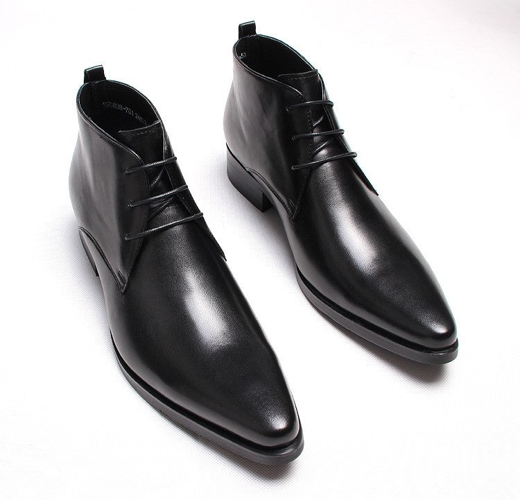 Black leather lace-up dress boots with pointed toe and low stacked heel.