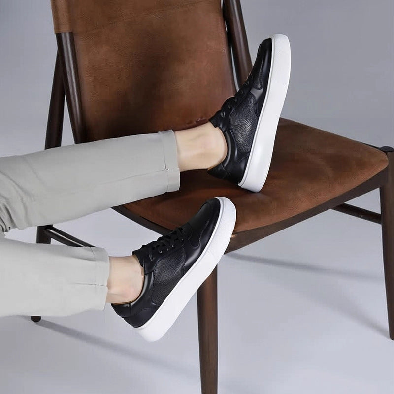 Men's leather sneakers, black, lace-up shoes with low white platform sole.