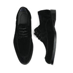 Men's black wingtip brogue Oxford shoes with chunky lug sole and lace-up design