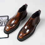 Dark brown leather Chelsea dress boots with brogue detailing and elastic side stretch panels