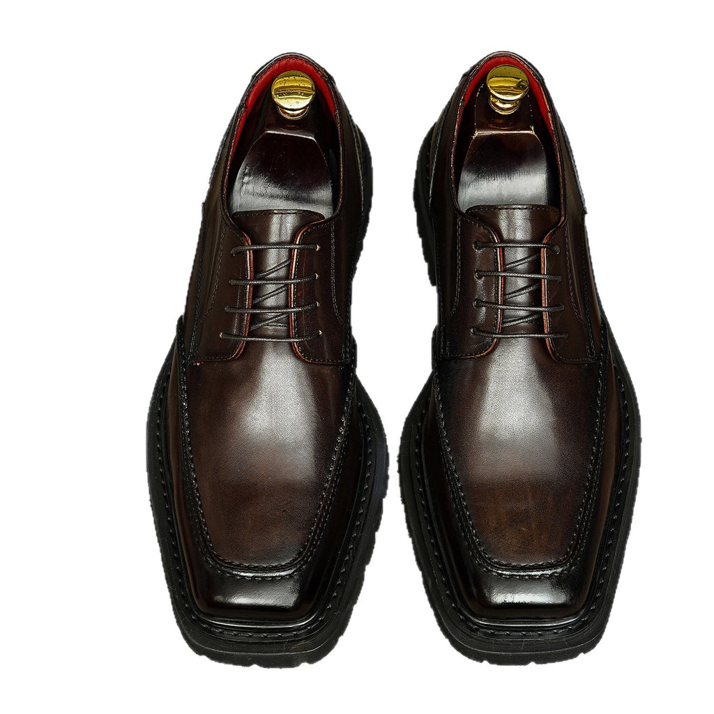 Men's chunky lug-sole wingtip brogue oxford shoes, dark brown, lace-up profile view.