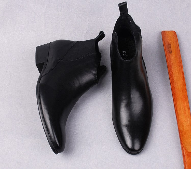Black leather Chelsea boots, side view with elastic gore and low block heel
