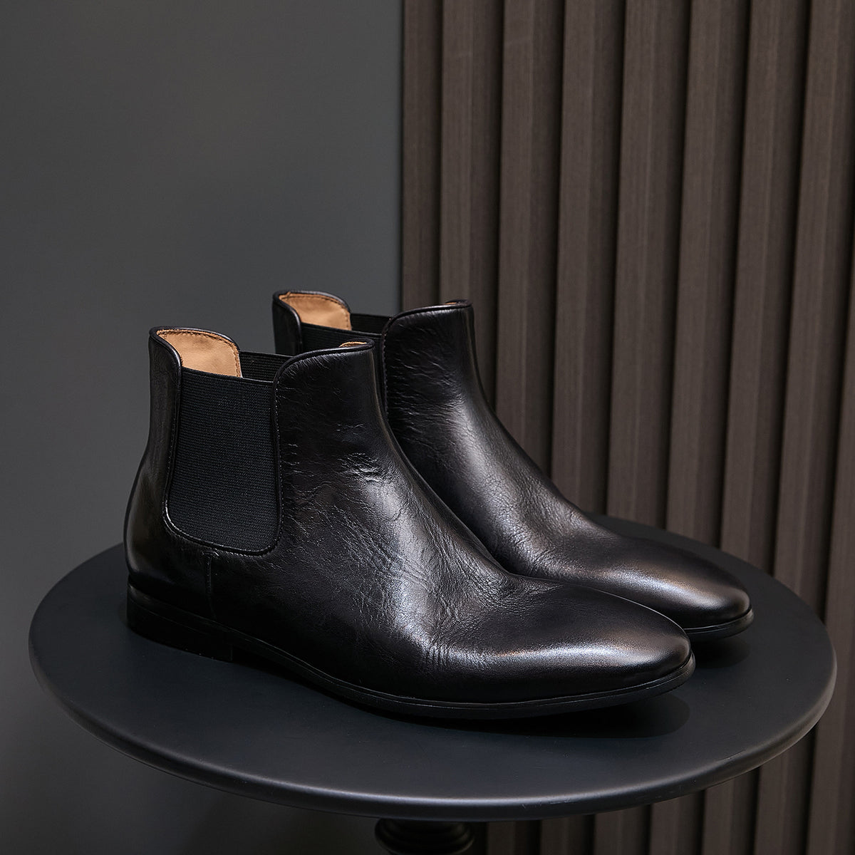 Pointed-toe suede Chelsea dress boots in black, elastic side panels