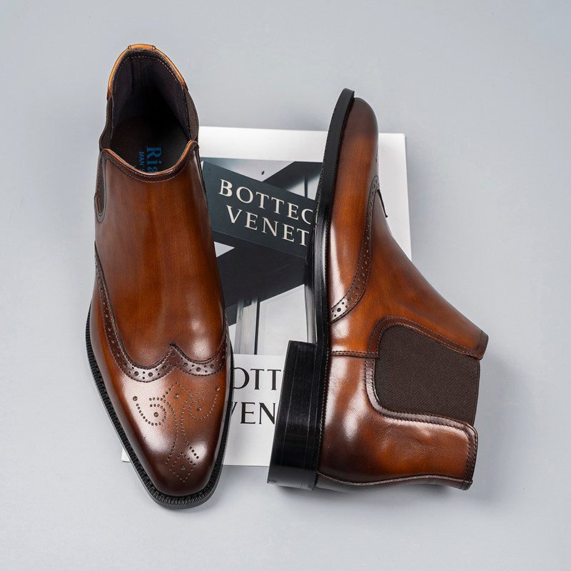 Brown leather slip-on Chelsea dress boots with elastic side panels and brogue detailing