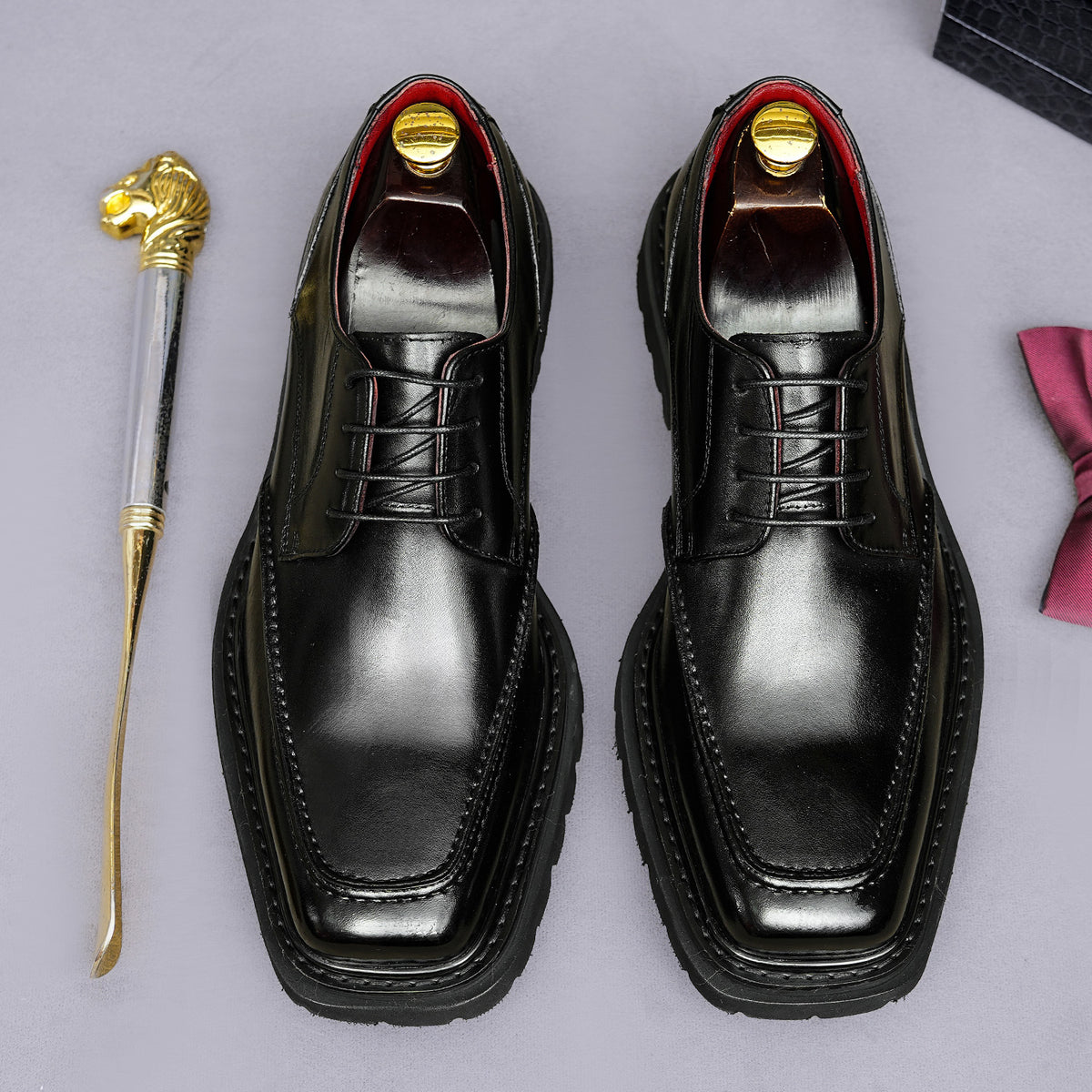 Men's chunky lug-sole wingtip brogue oxford shoes, black, lace-up front view.