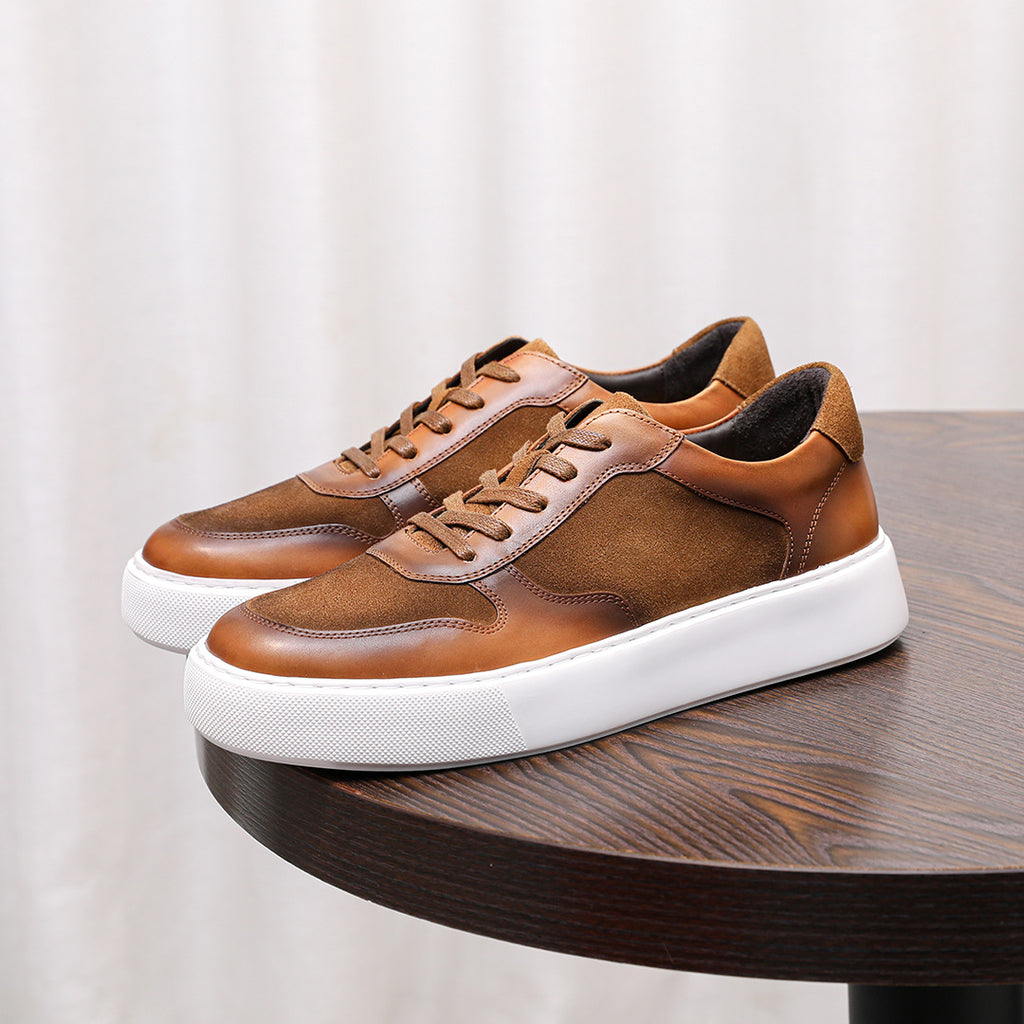 Brown leather lace-up sneakers with white rubber sole and low-profile side panels