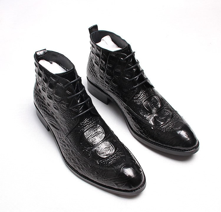 Black lace-up dress boots with wingtip stitching and glossy textured finish