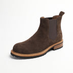 Pointed-toe suede Chelsea boot in dark brown with elastic side gore and pull tab