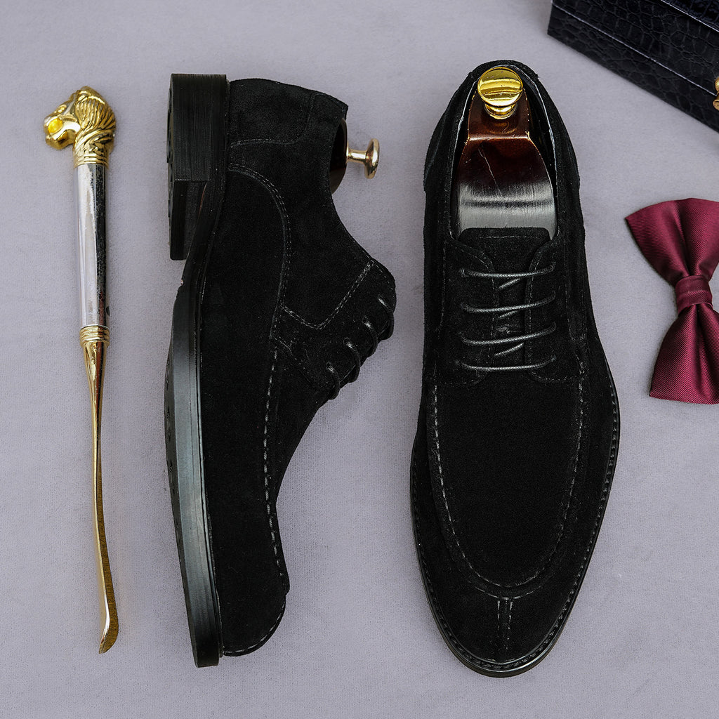 Men's black wingtip brogue Oxford shoes with chunky rubber lug sole, lace-up