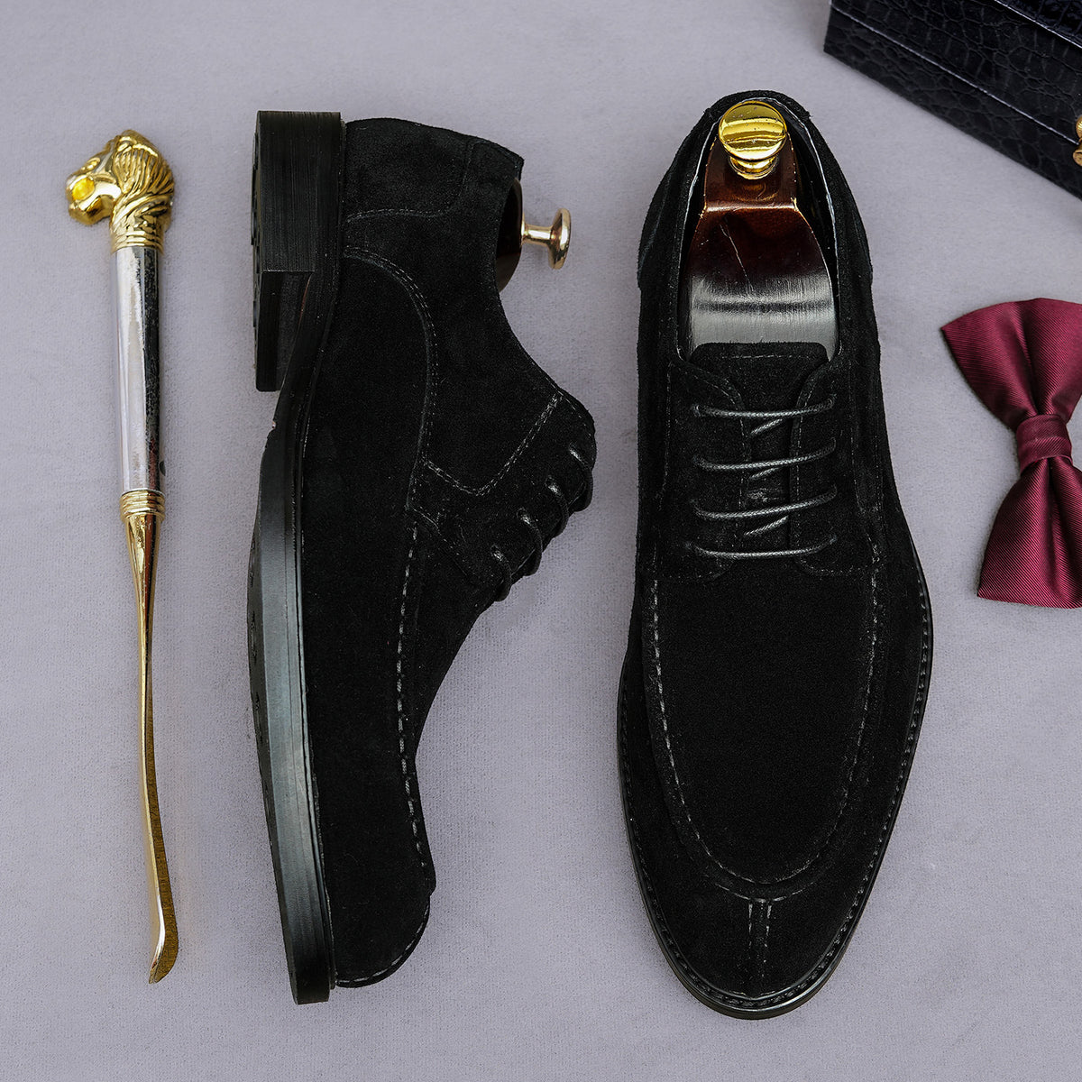 Men's black wingtip brogue Oxford shoes with chunky rubber lug sole, lace-up