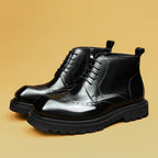 Black leather lace-up ankle boots with thick sole and wingtip-style toe
