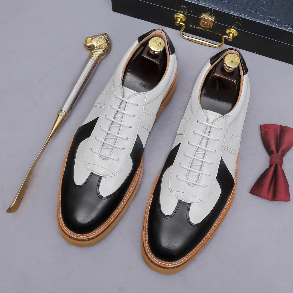 Men's white and black leather suede lace-up sneakers with tan gum lug sole
