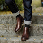 Dark brown leather pointed-toe ankle boots with side zipper and low stacked sole