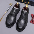 Men's chunky lug sole wingtip brogue oxfords, black pair, lace-up with brogue perforations