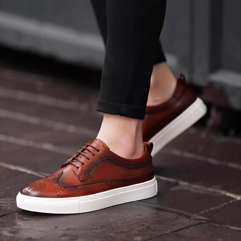 Men's genuine leather sneakers, dark brown lace-up with wingtip perforations and white sole.