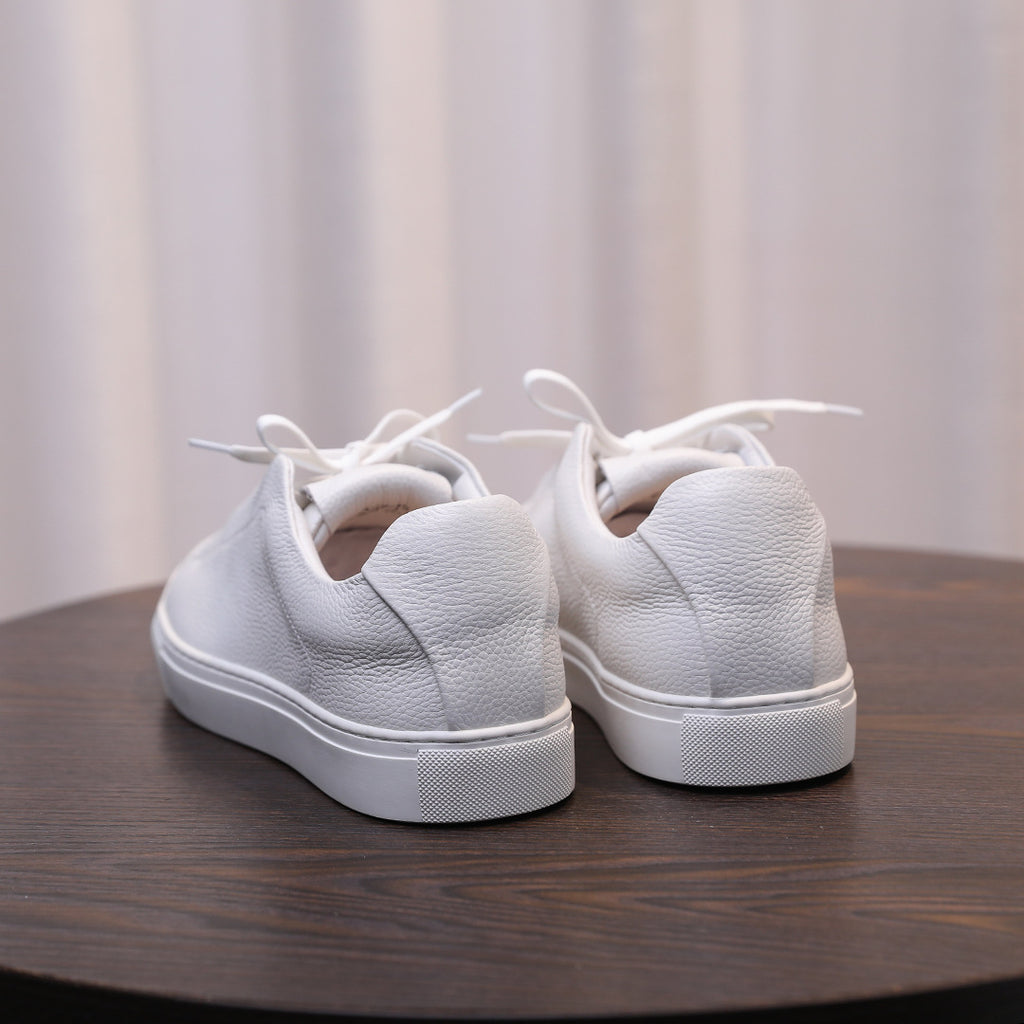 Men's genuine leather sneakers, white heel view with lace-up and low rubber outsole