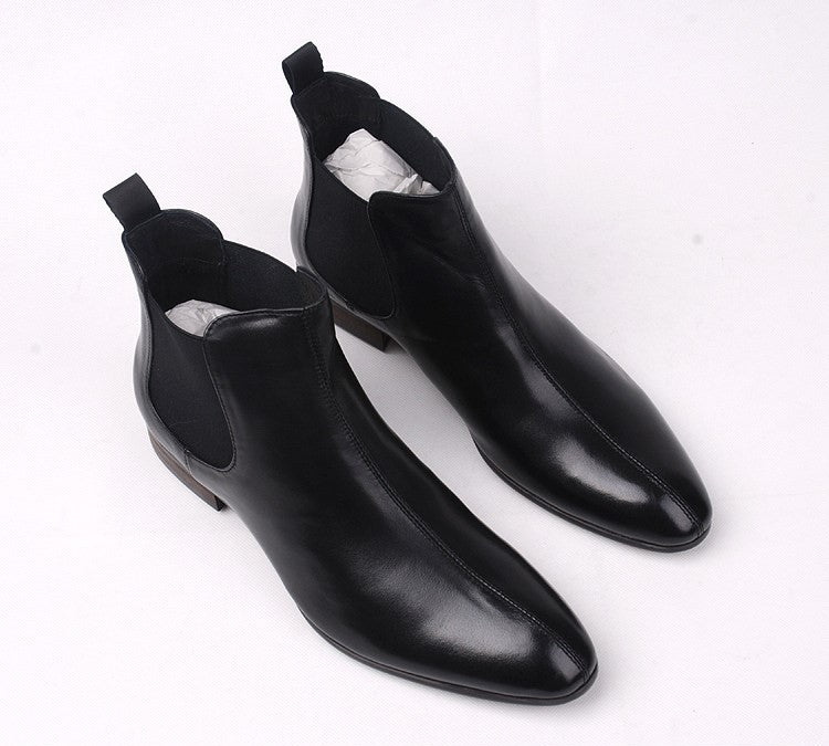 Black leather Chelsea ankle boots with elastic side panels and low heel.