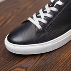Men's genuine leather sneaker toe with white laces and textured black leather
