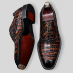 Dark brown croc-textured wingtip brogue oxfords with chunky lug sole, lace-up.