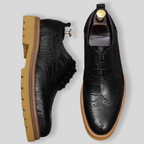 Men's black pointed-toe leather derby dress shoes, lace-up with wingtip perforations