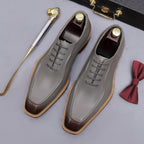 Gray chunky lug-sole brogue Oxford shoes with gray laces, lace-up side view