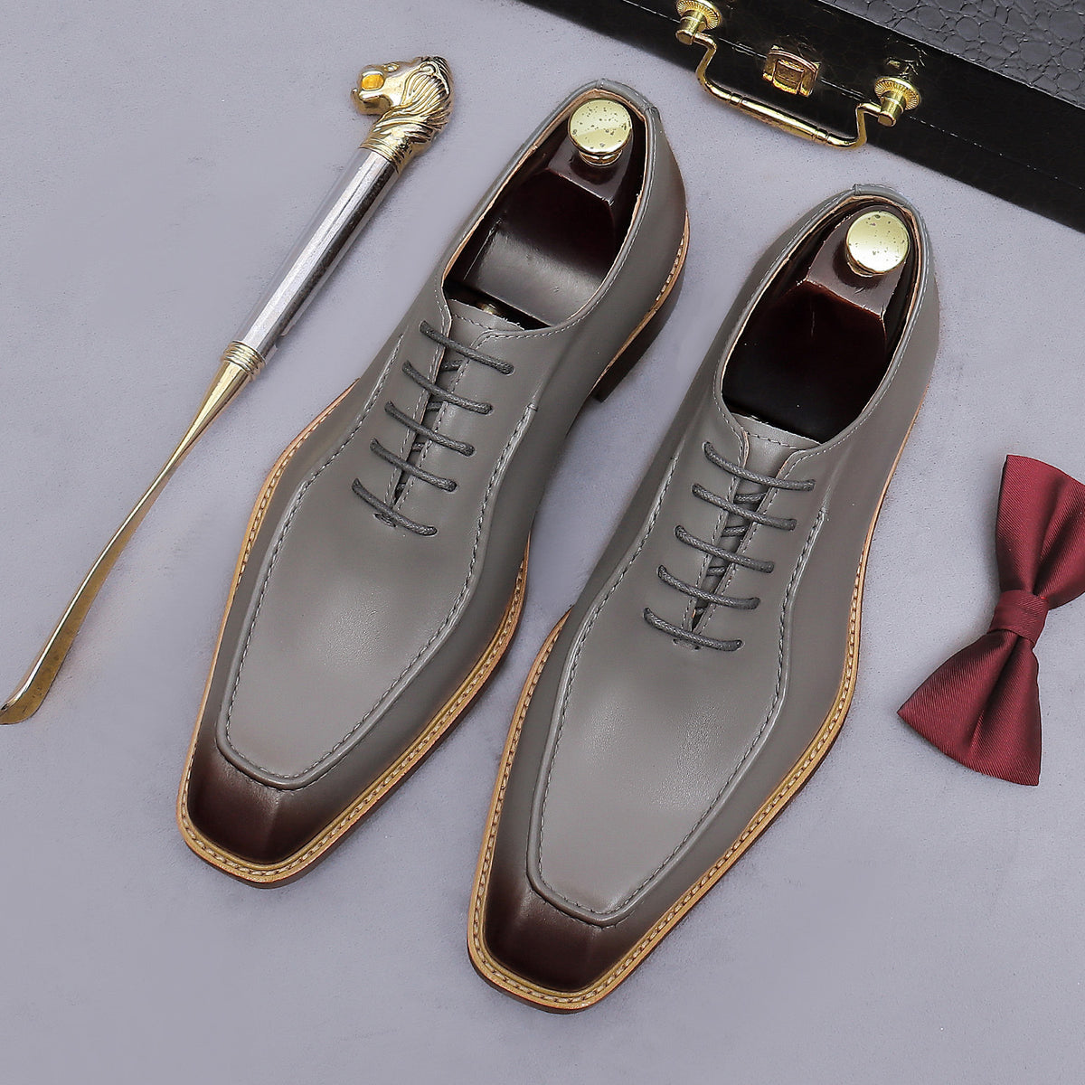 Gray chunky lug-sole brogue Oxford shoes with gray laces, lace-up side view