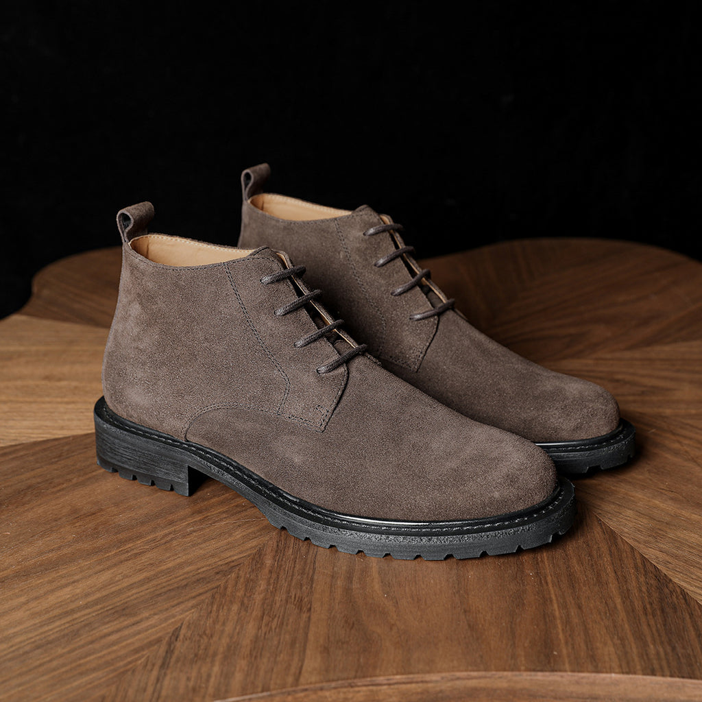 Men's suede chukka boots, plain toe, lace-up closure, medium brown, rugged rubber sole.