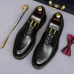 Men's chunky lug-sole wingtip brogue oxfords, black leather with dark laces