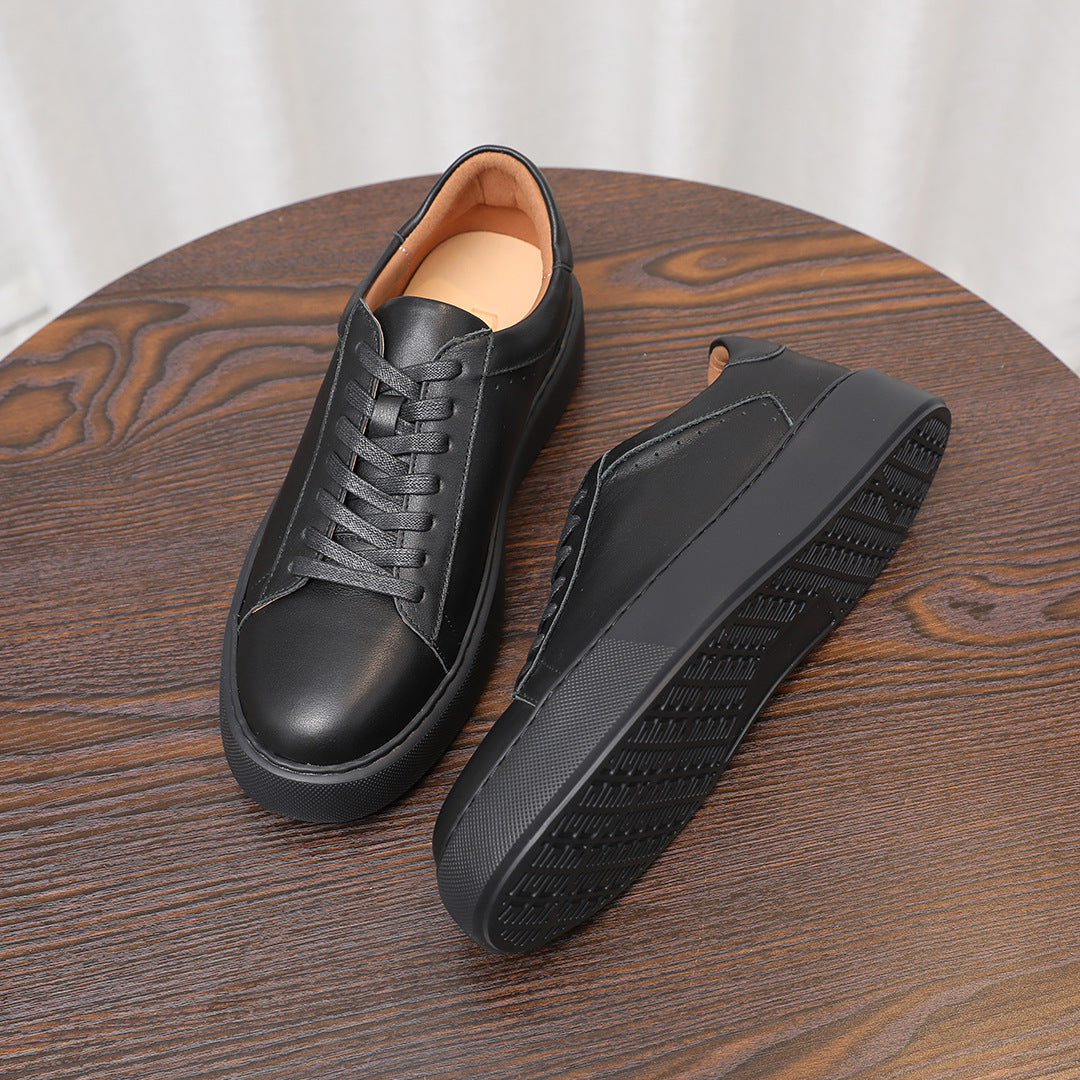 Men's black leather sneakers with textured tread sole, lace-up casual shoes